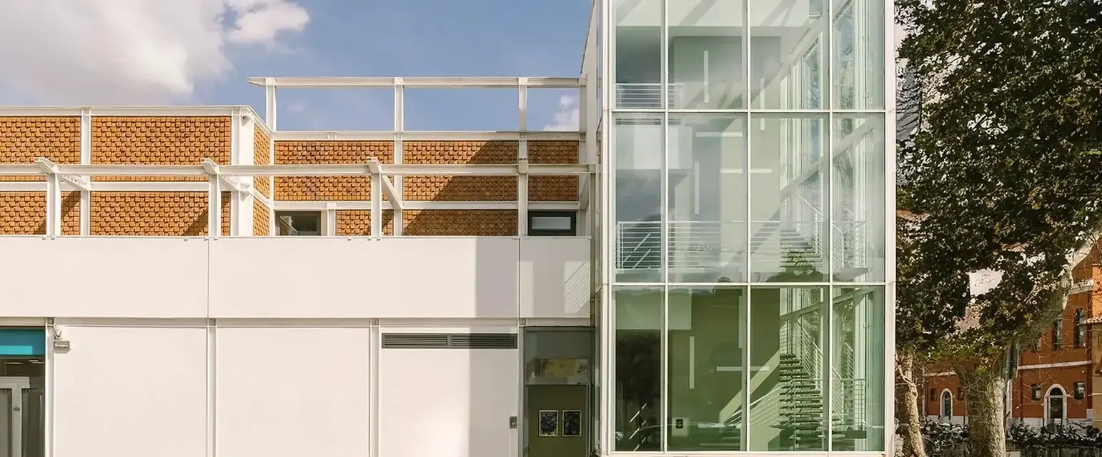 a building with glass walls and stairs