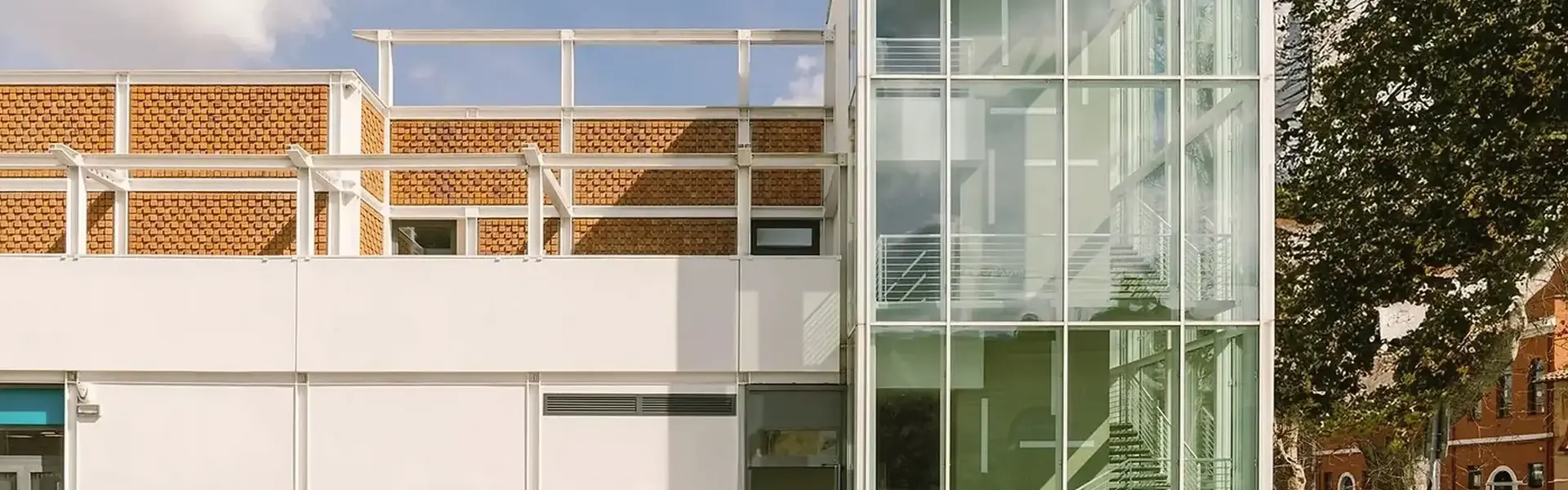 a building with glass walls and stairs