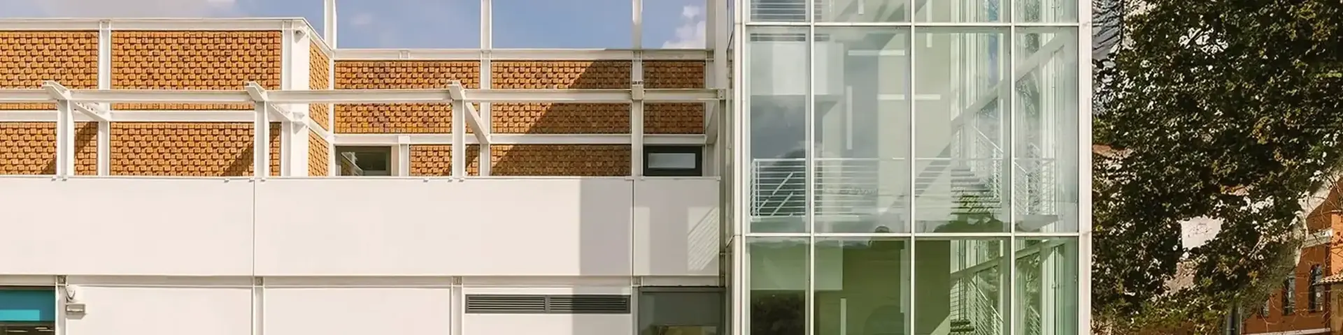 a building with glass walls and stairs