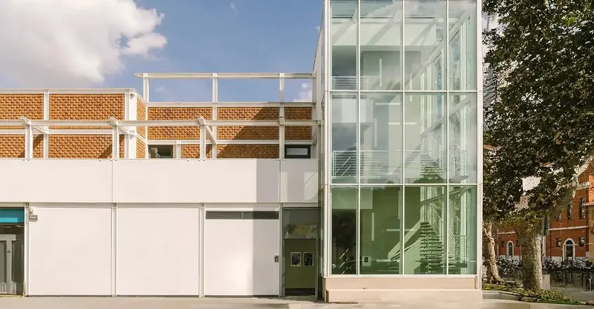 a building with glass walls and stairs