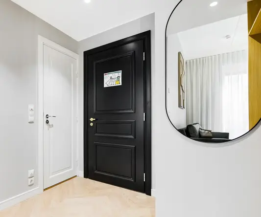 a black door in a room