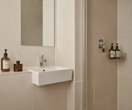 a bathroom with a mirror and sink