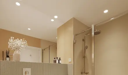 a bathroom with a shower and sink