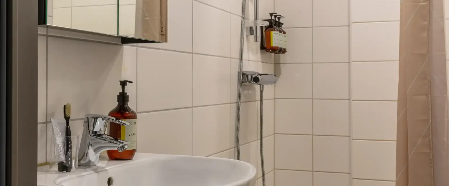a bathroom with a shower and sink