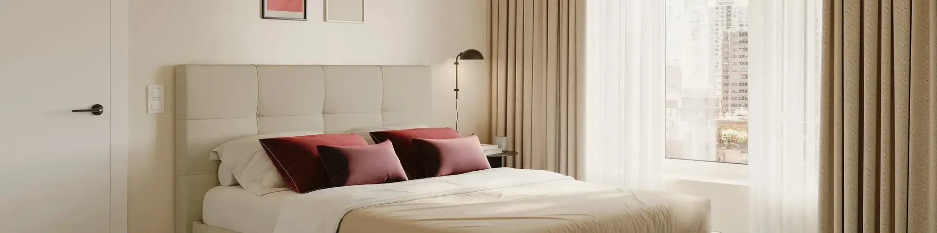 a bed with a lamp and a window