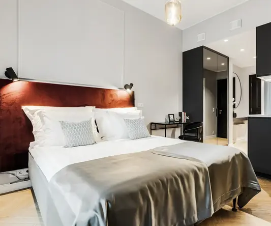 a bed with a light fixture