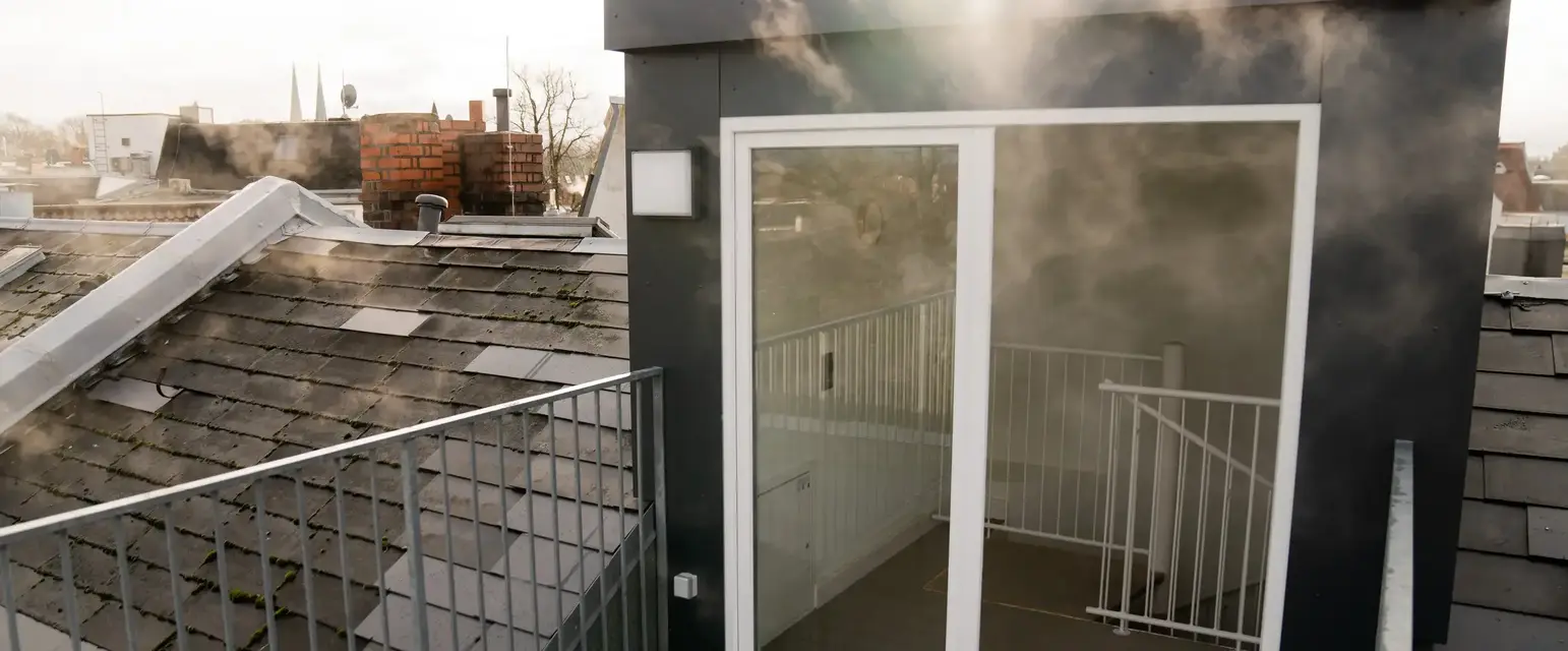 a balcony with a glass door and a railing