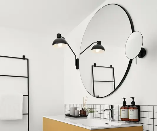 a bathroom with a mirror and sink