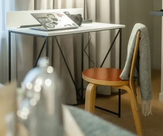 a chair and a laptop on a table