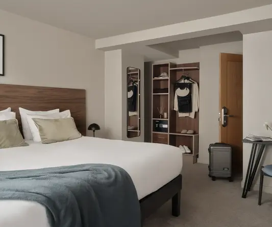 a bedroom with a bed and a closet