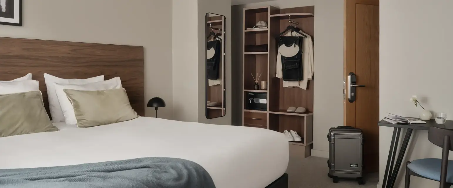 a bedroom with a bed and a closet