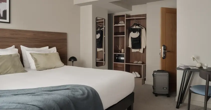 a bedroom with a bed and a closet