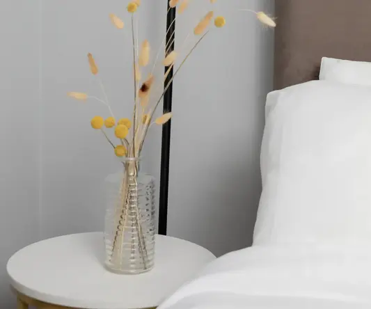 a lamp next to a table