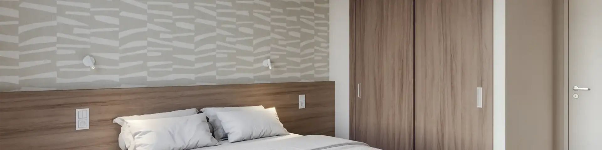 a bed with a wood cabinet and a green light from the ceiling