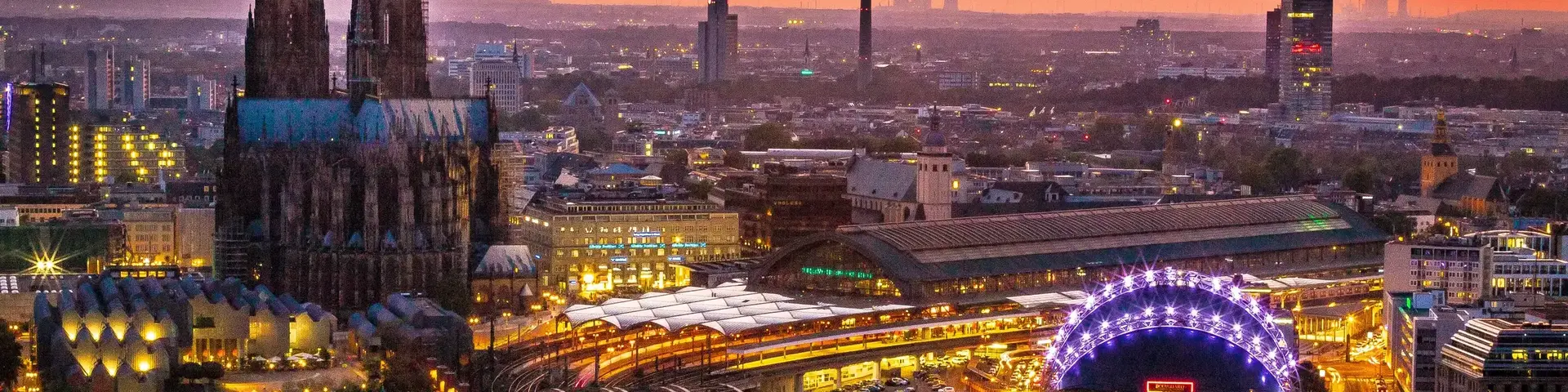 a bridge over a river with a large building and a bridge