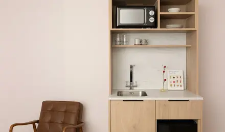 a kitchen with a microwave and a sink