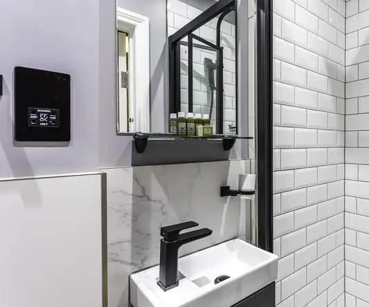 a bathroom with a sink and shower