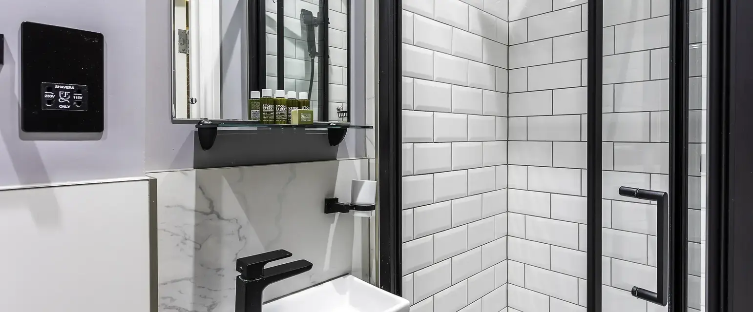 a bathroom with a sink and shower