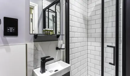 a bathroom with a sink and shower