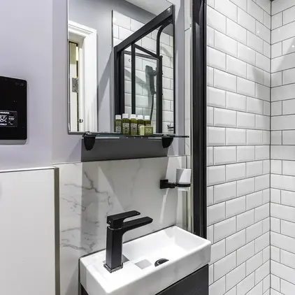 a bathroom with a sink and shower