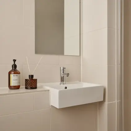 a bathroom with a mirror and sink