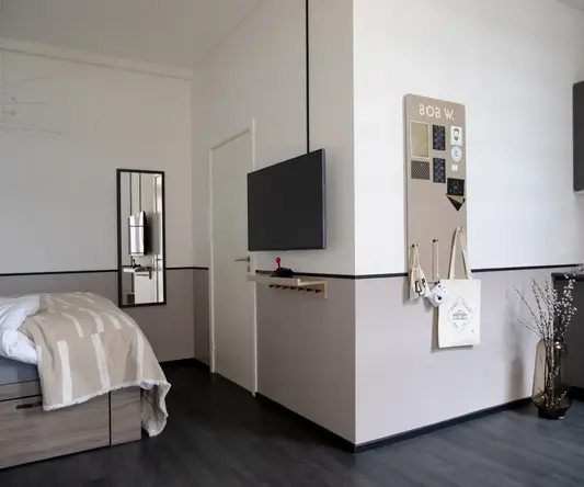 a room with a tv on the wall