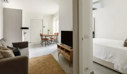 a living room with a tv and a table