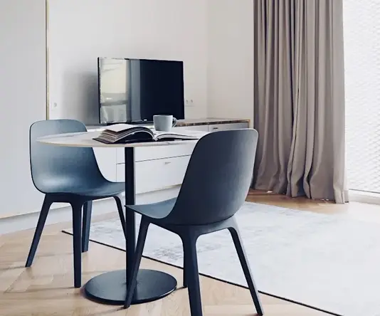 a room with a table and chairs