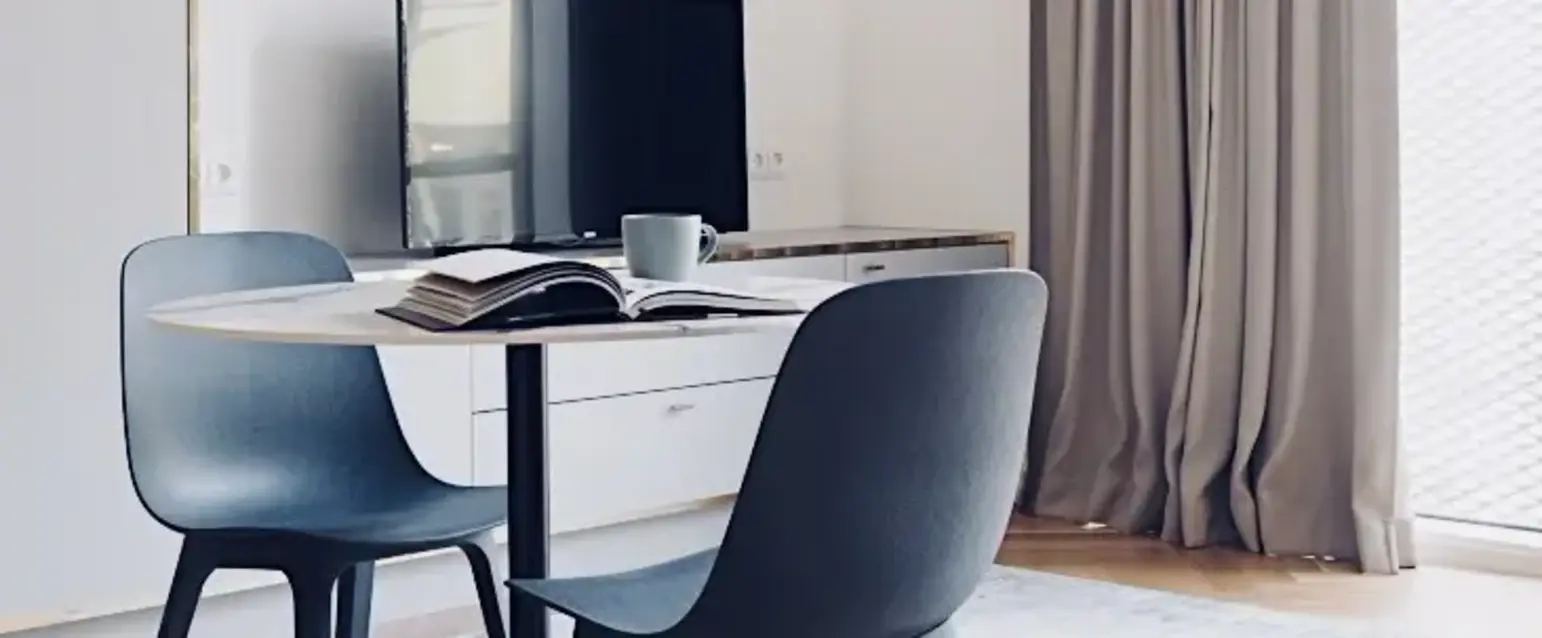 a room with a table and chairs