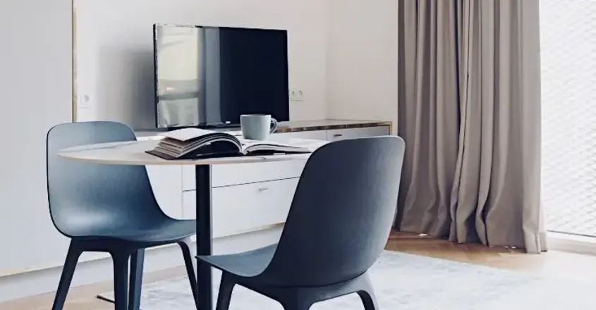 a room with a table and chairs