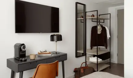 a room with a tv and a desk