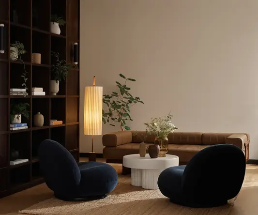 a living room with a couch and a lamp