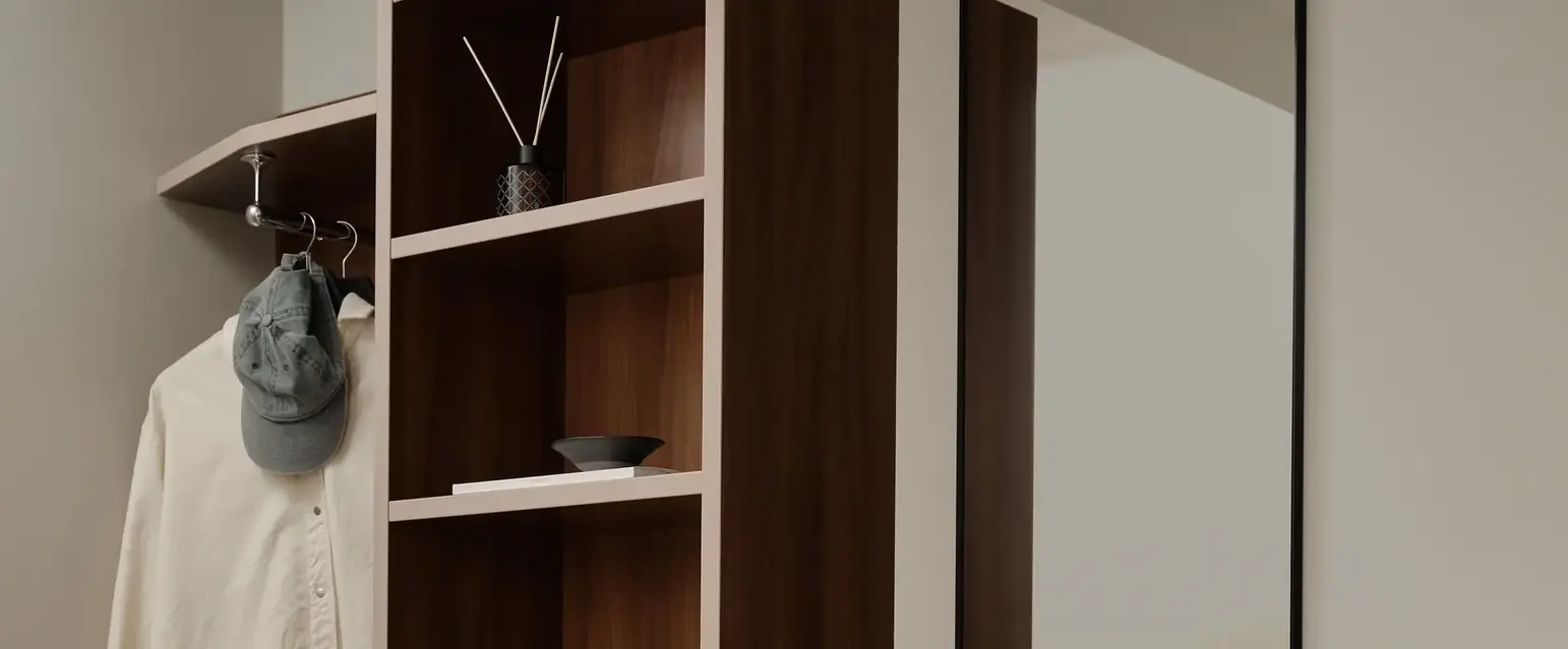 a mirror next to a closet