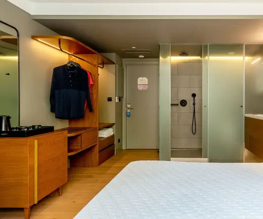 a room with a bed and shower