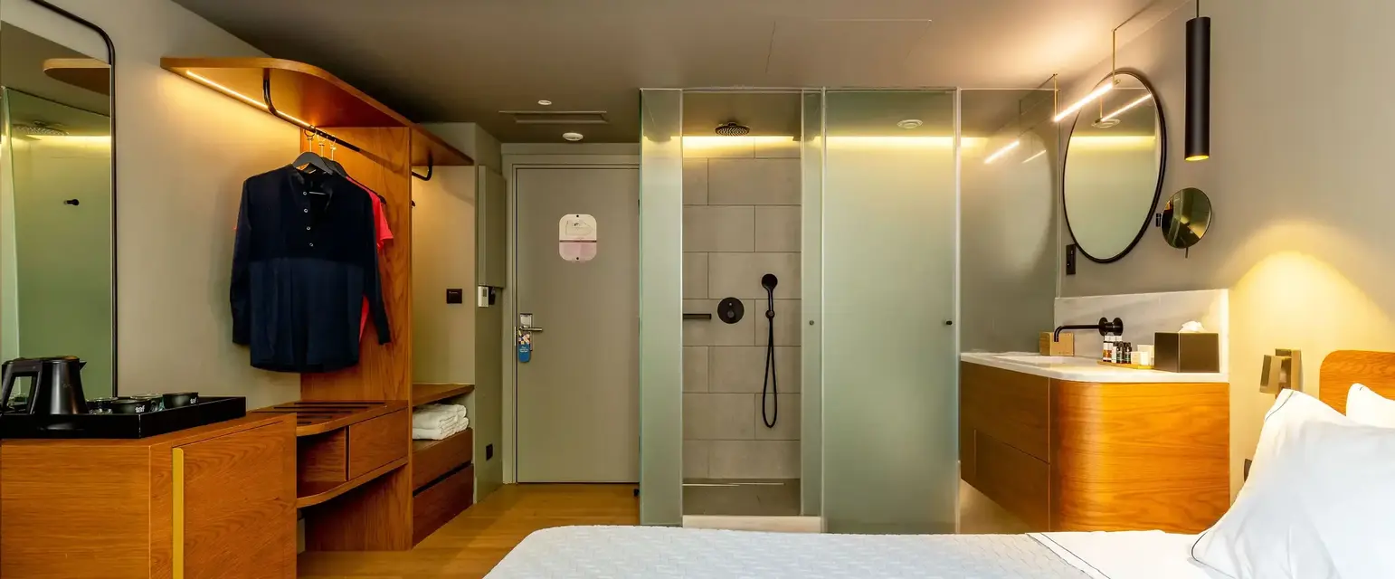 a room with a bed and shower