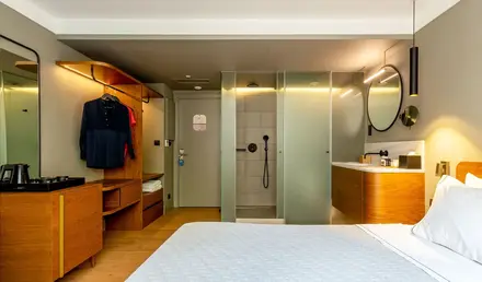 a room with a bed and shower