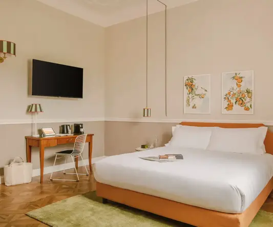 a room with a bed and a desk