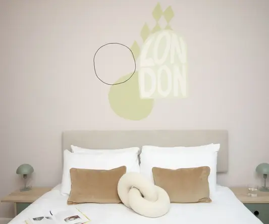 a bed with pillows and a knot on it