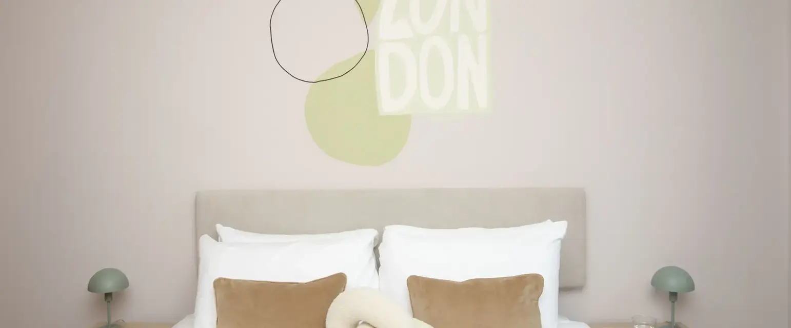 a bed with pillows and a knot on it