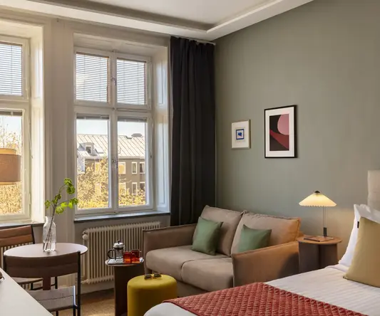 a room with a couch and a bed