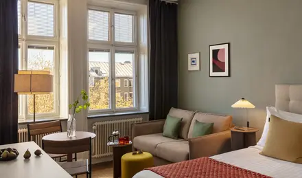 a room with a couch and a bed