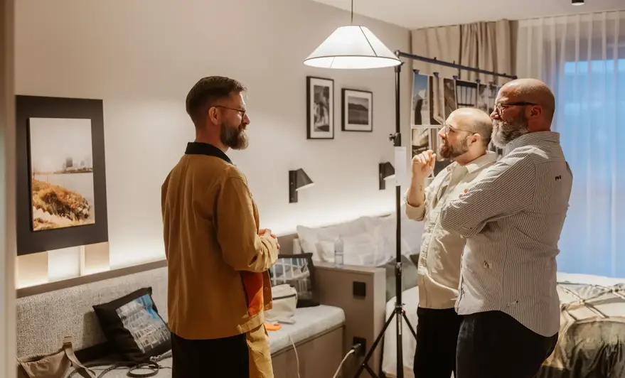 a group of men standing in a room