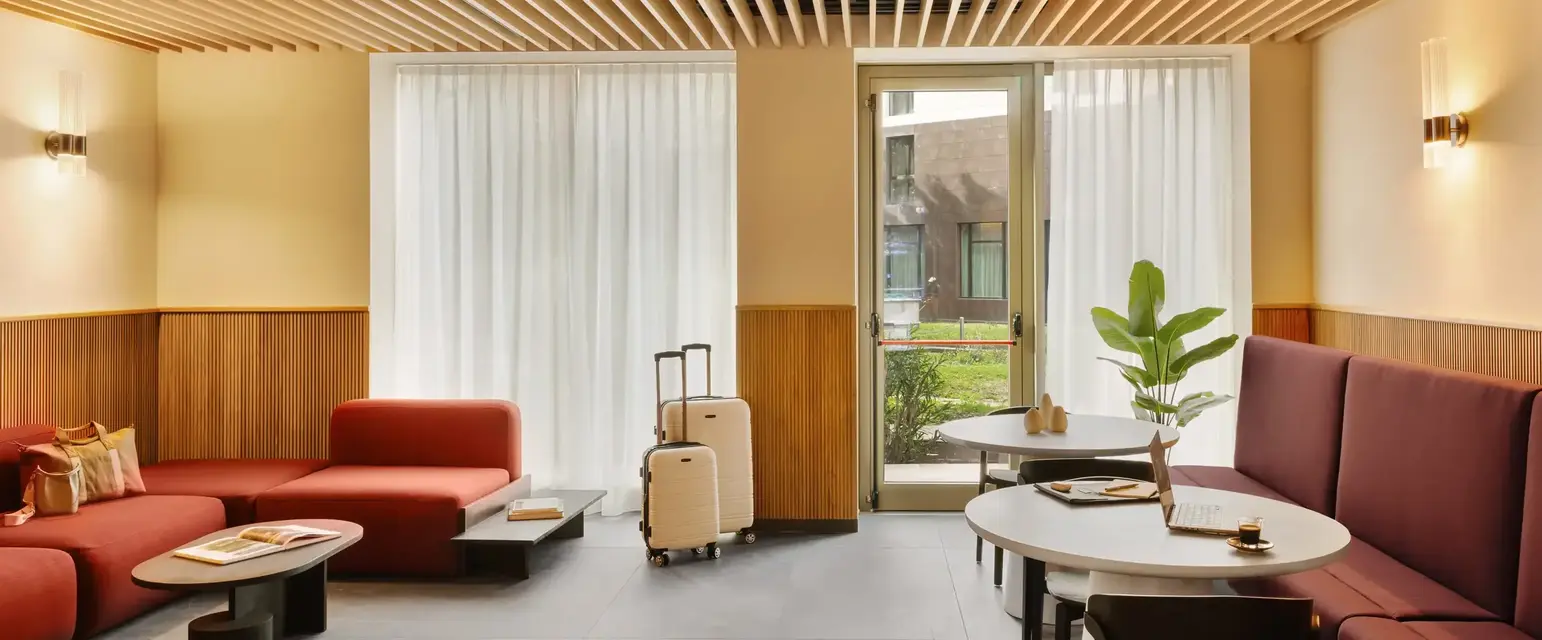 a room with chairs and tables and luggage