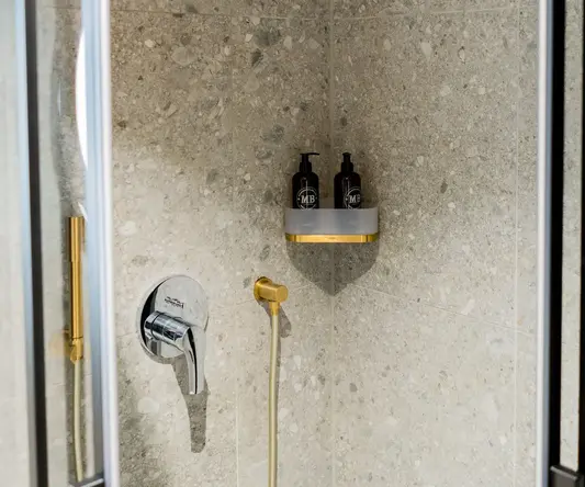a shower with a shower head and shower head