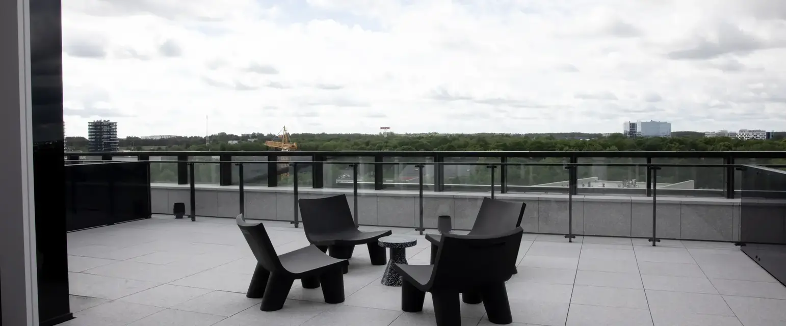 a group of chairs on a rooftop