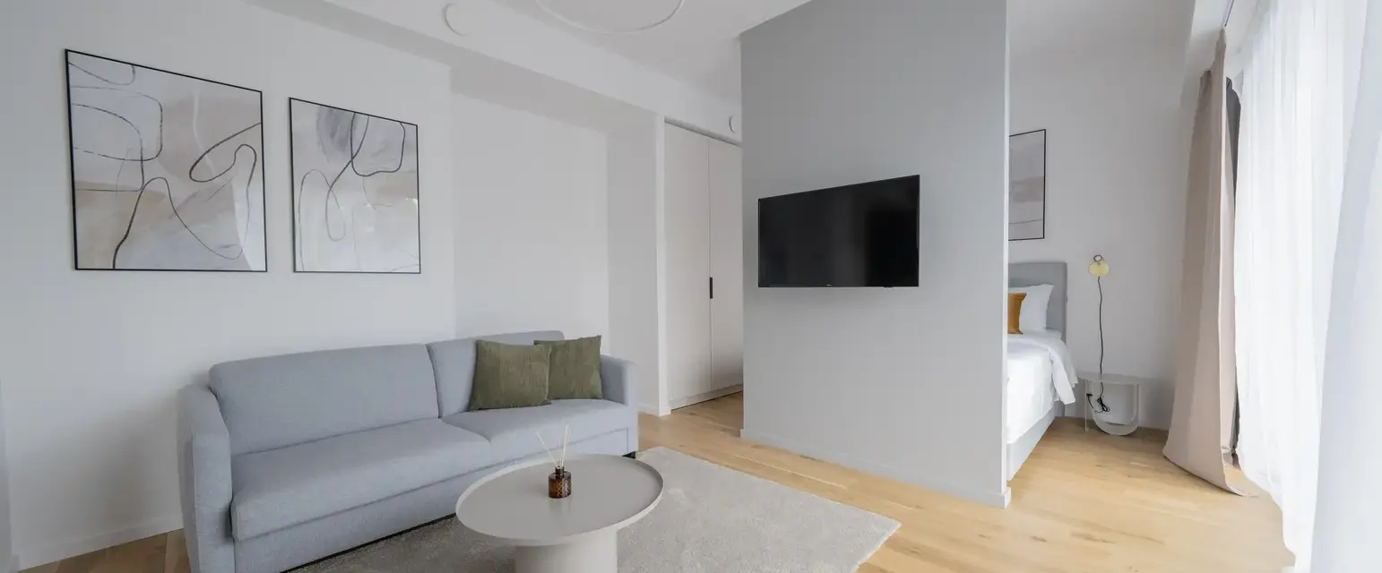 a living room with a couch and a tv