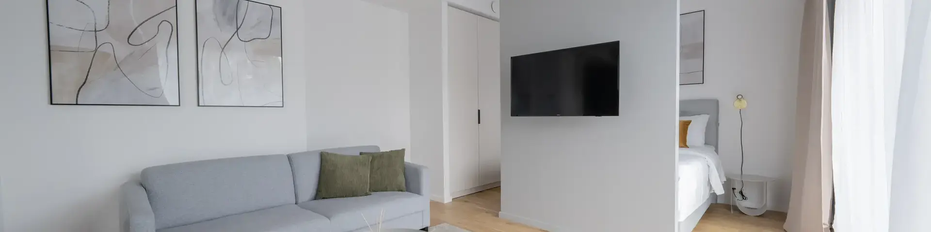 a living room with a couch and a tv