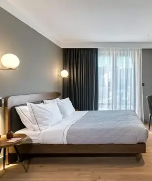 a bedroom with a bed and a tv