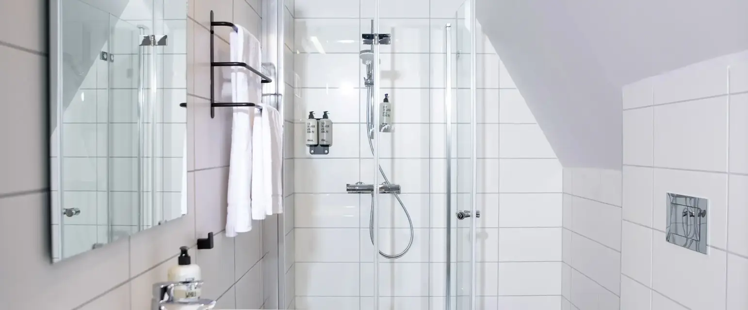 a bathroom with a shower and sink