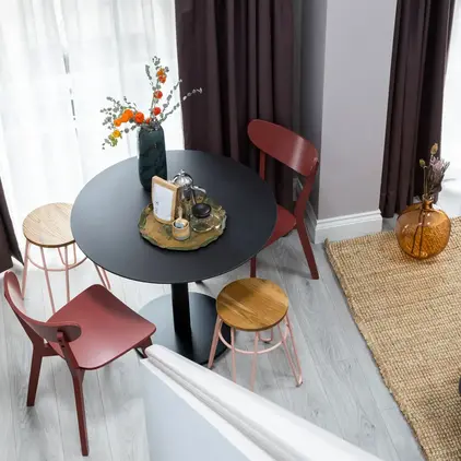 a living room with a table and chairs